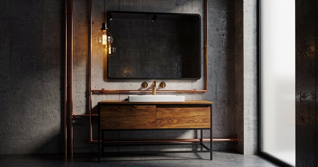 Salle de bain de style industriel avec miroir noir, tuyauterie cuivre apparente et suspension à filament